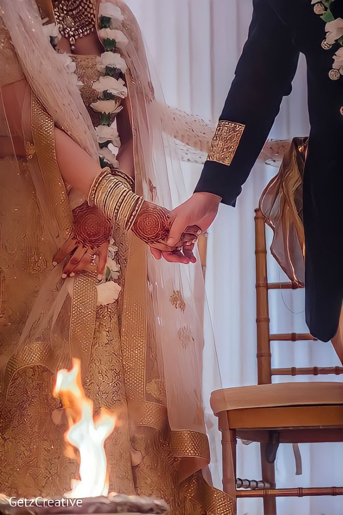 Bride and groom exchanging vows in a beautifully decorated outdoor wedding venue.